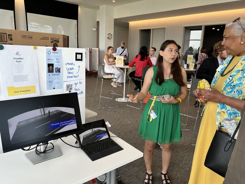 Mary presenting FloodNet project to Expo visitor
